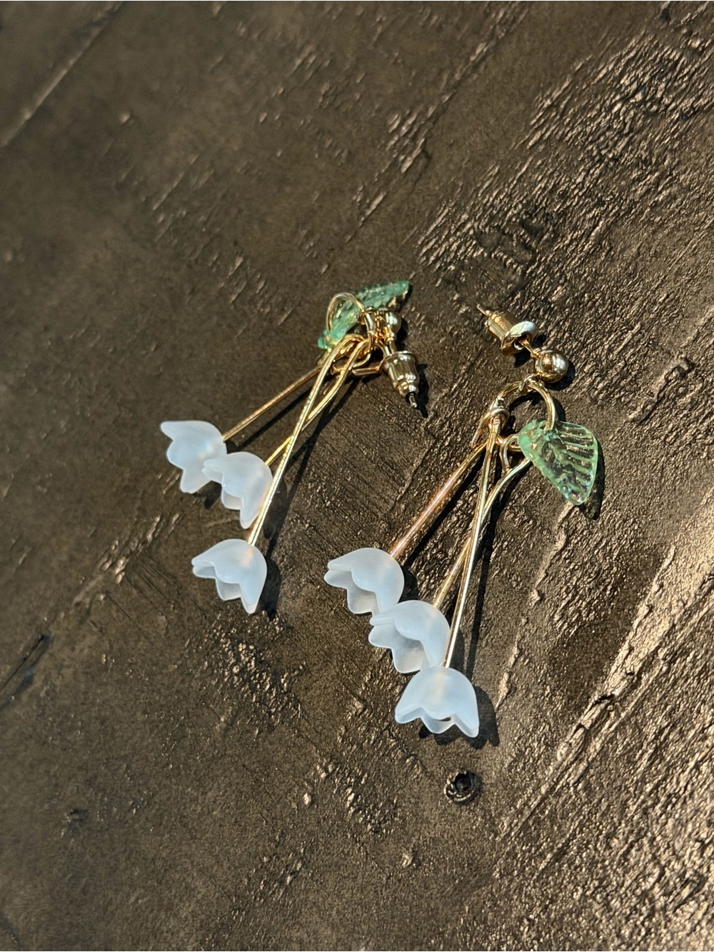 Gold and White Floral Drop Earrings with Green Leaf Accents